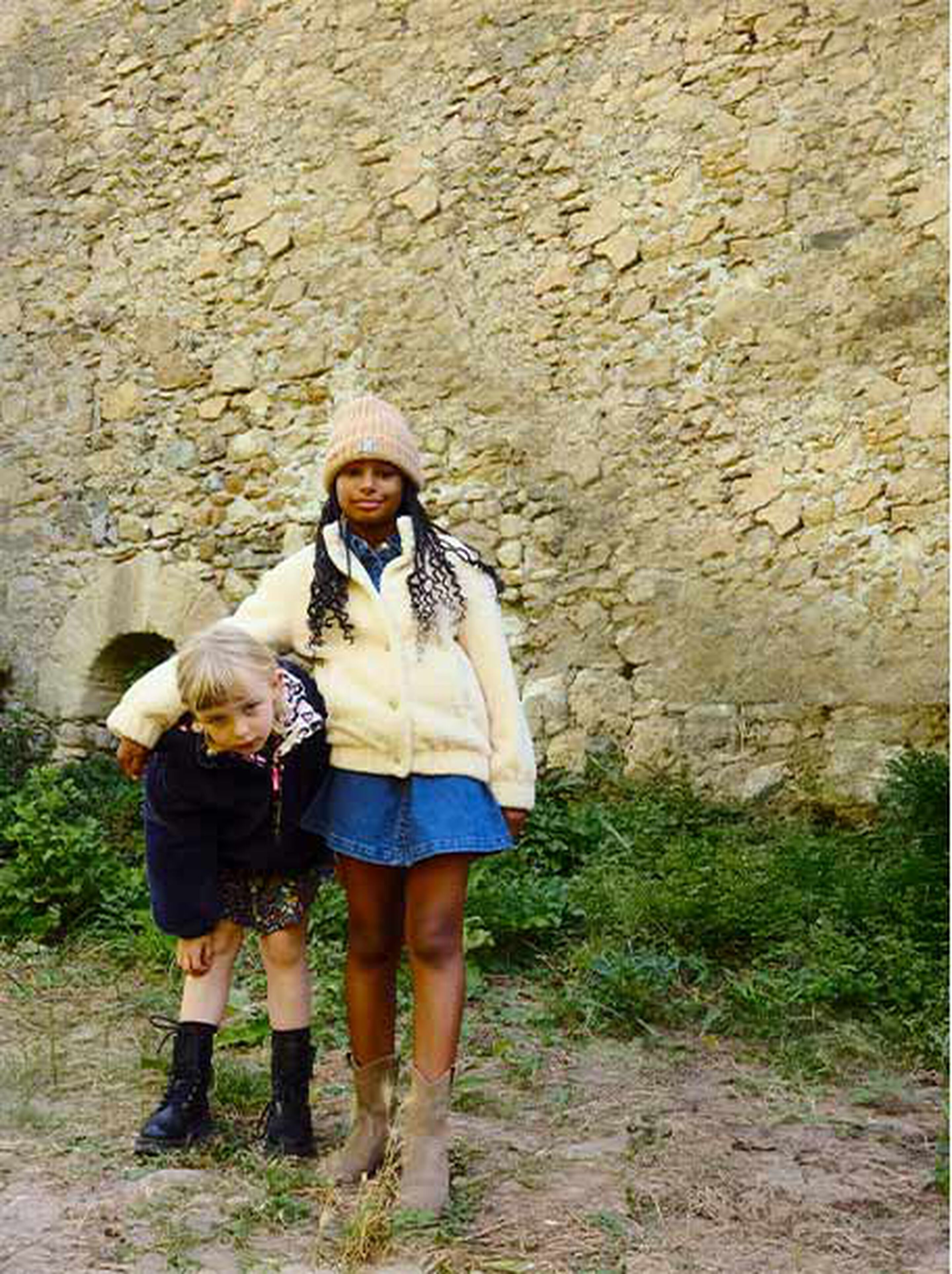 Child wearing a warm coat and Timberland boots in a Scottish countryside setting