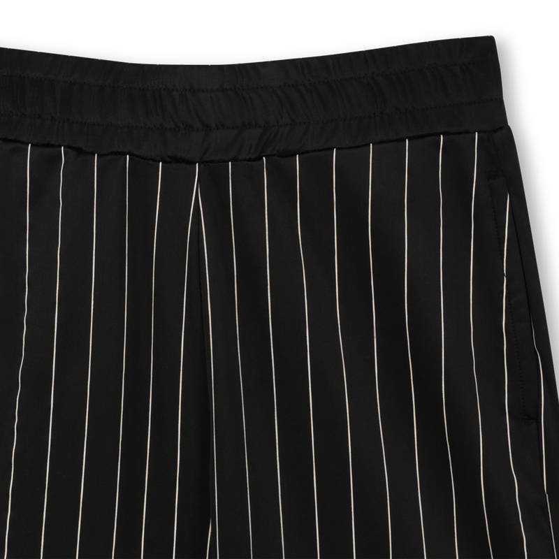 Pantal&oacute;n corto el&aacute;stico DKNY 
                        UNISEXO