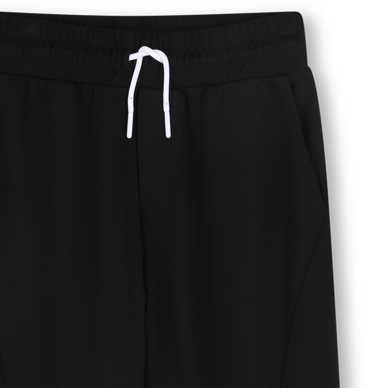 PANTAL&Oacute;N CON BOLSILLOS DKNY 
                        UNISEXO