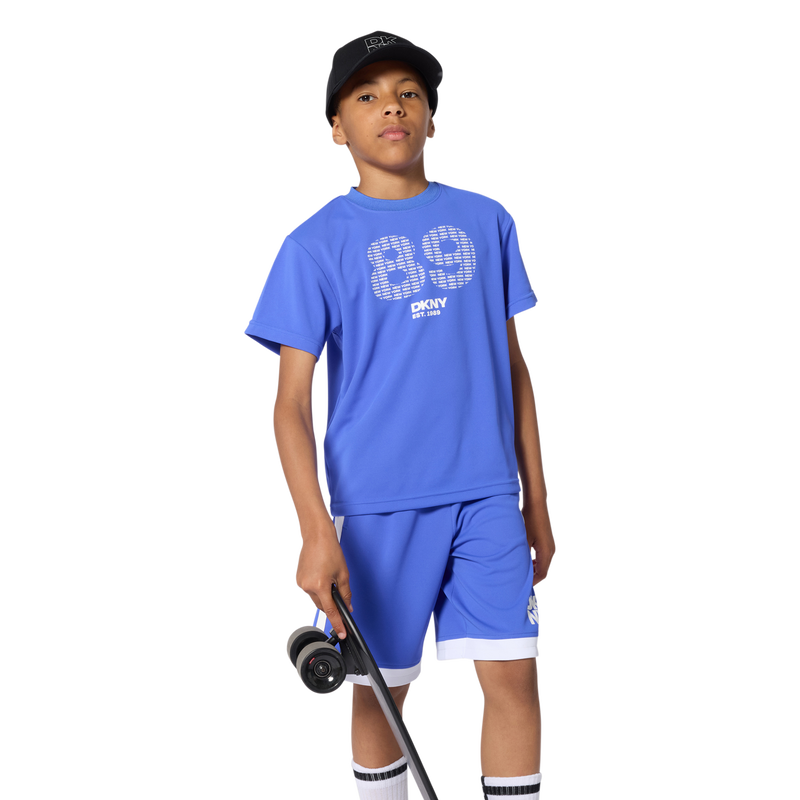 PANTALONES CORTOS LARGOS DKNY 
                        UNISEXO