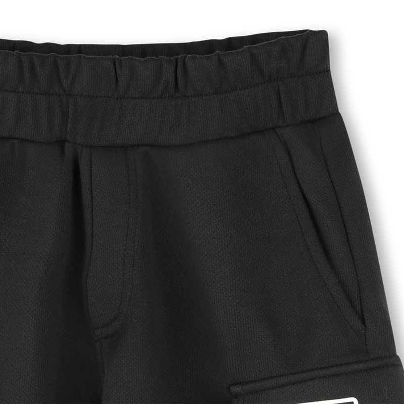 Bermudas con bolsillos DKNY 
                        UNISEXO